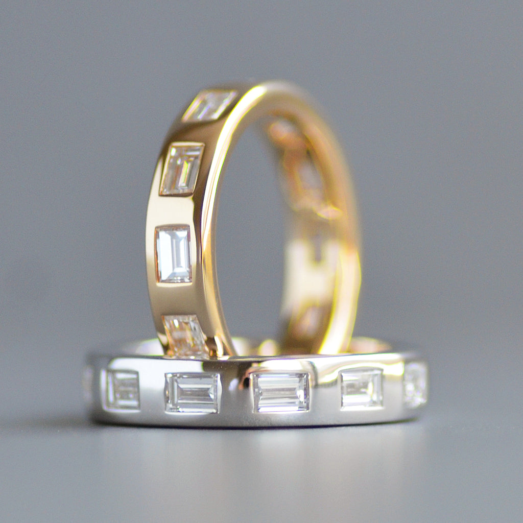 Wide emerald cut eternity band