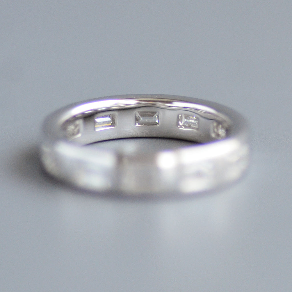 Wide emerald cut eternity band