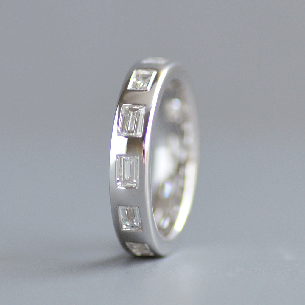 Wide emerald cut eternity band