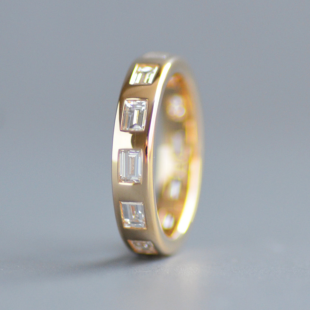 Wide emerald cut eternity band