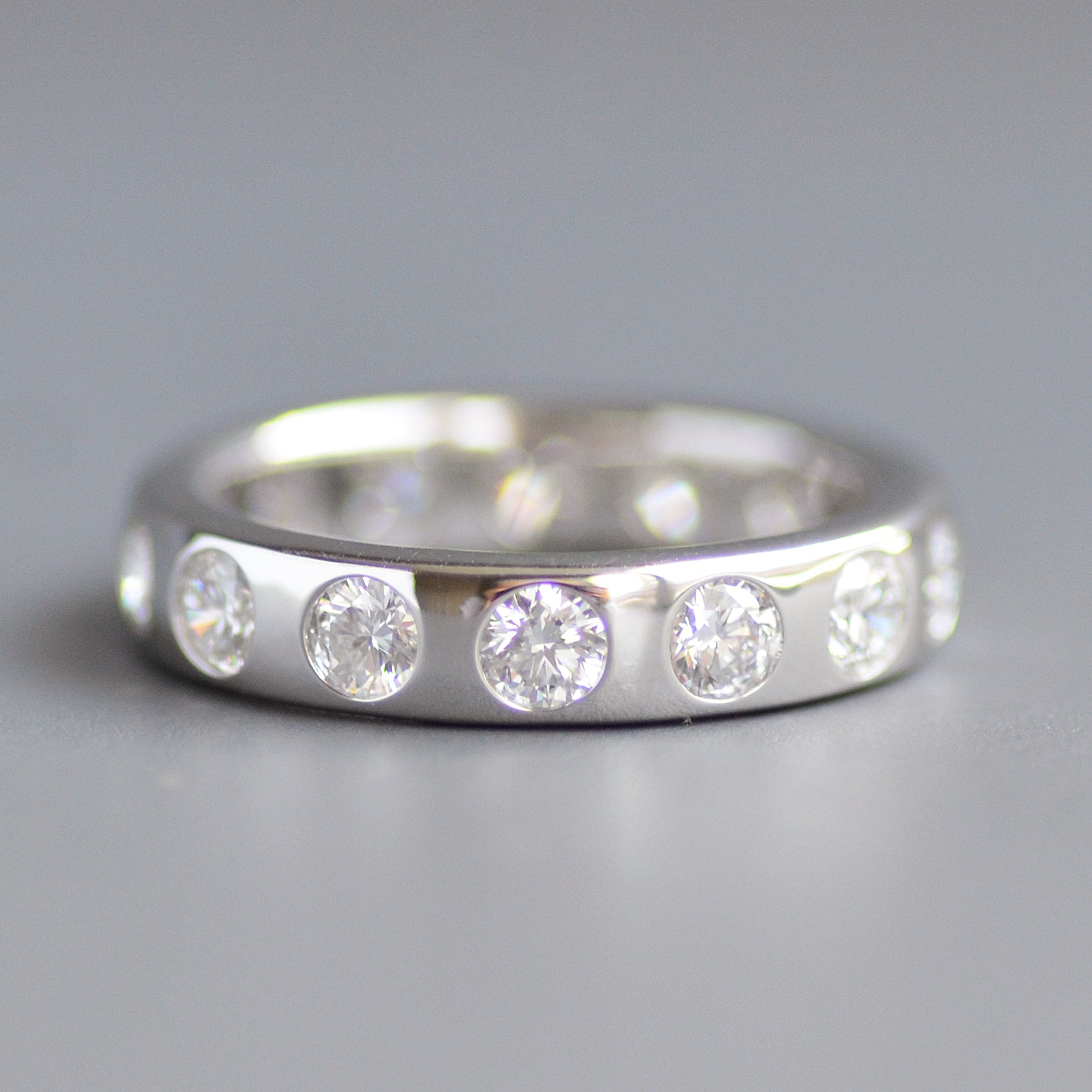 Wide round cut eternity band