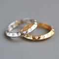 Knife edge eternity band rounds alternating