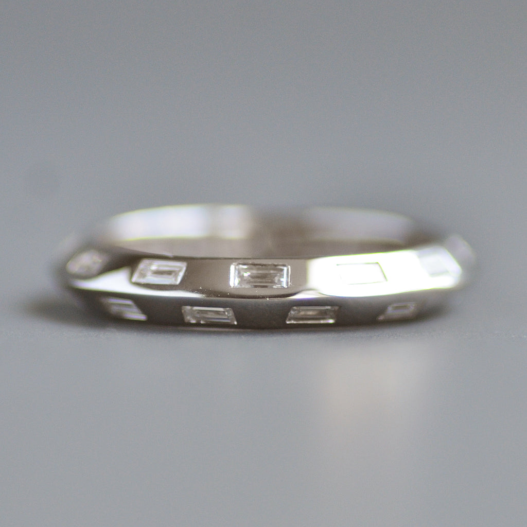 Knife edge eternity band baguettes alternating