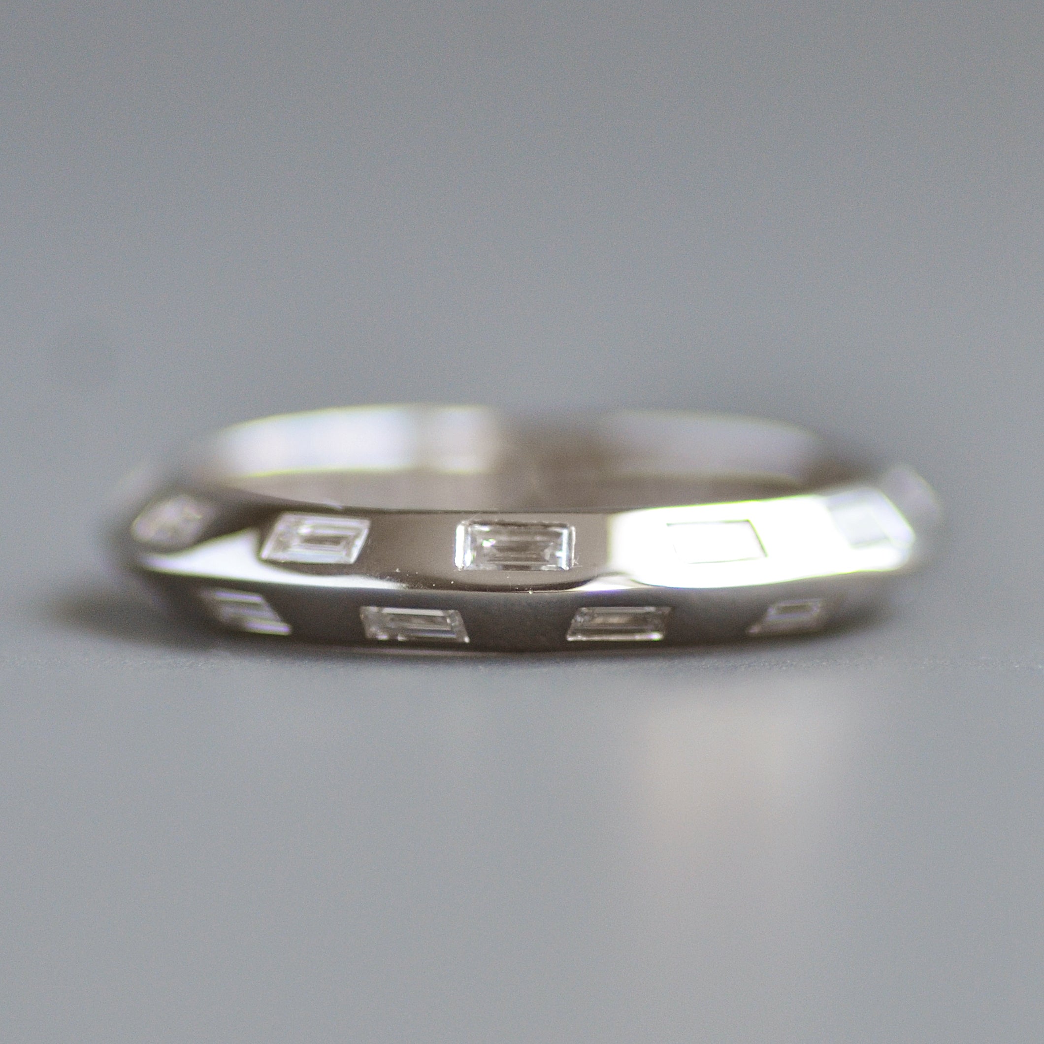 Knife edge eternity band baguettes alternating